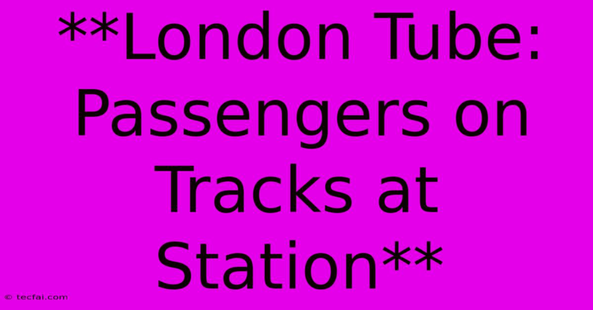 **London Tube: Passengers On Tracks At Station**